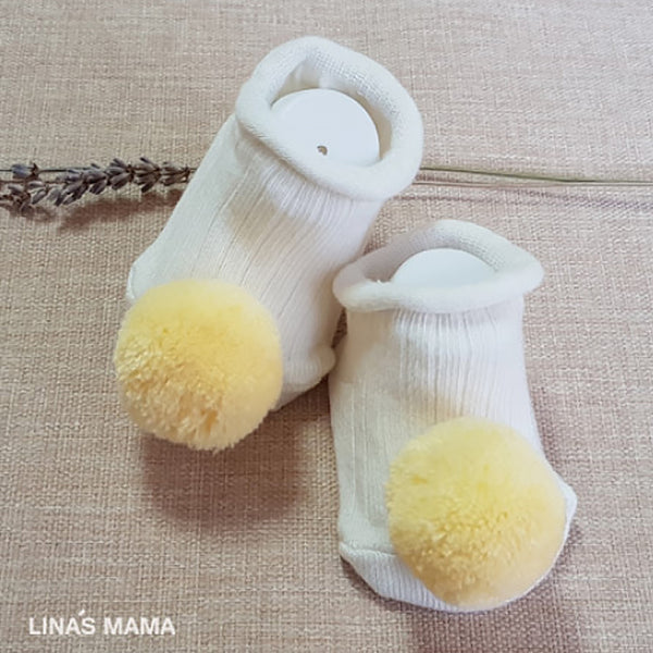 organic baby booties for newborn to 12 months - pastel pompoms